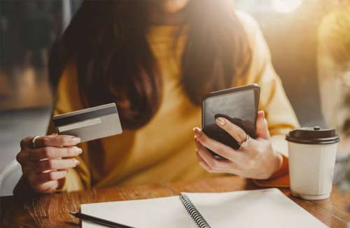 business woman holding a credit card