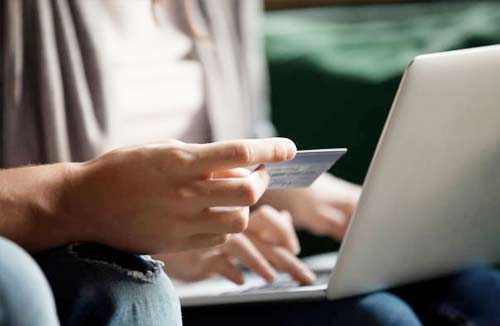 person holding a credit card