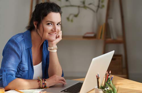 woman looking at her laptop